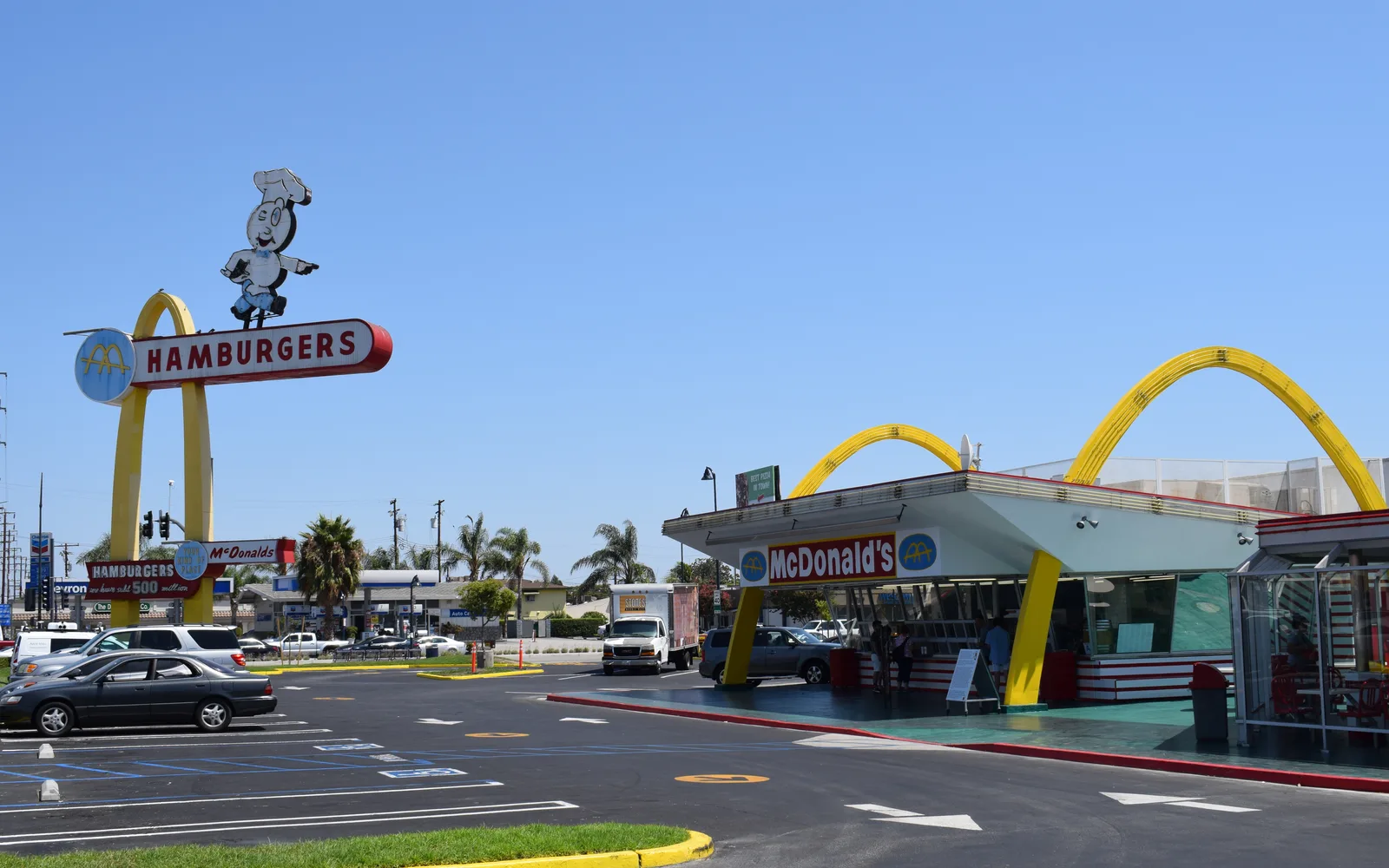 The distinctive Googie-style architecture of the historic McDonald's restaurant in Downey with its signature parabolic arches and neon signage